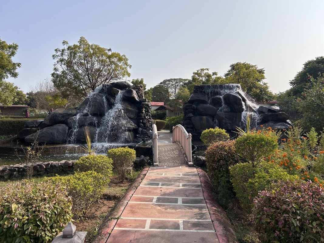 The rock waterfall and garden path on the property